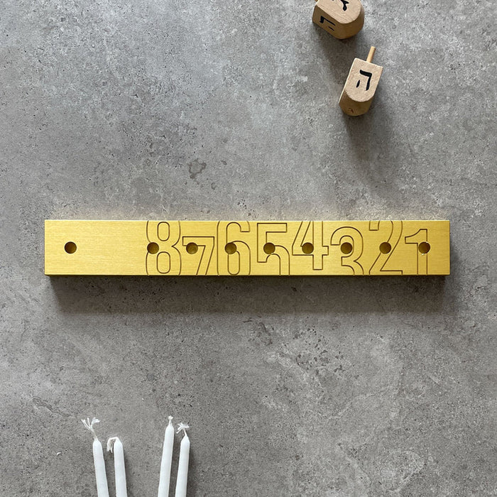 'Numbers' Chanukiah in Gold Aluminium by Kariniti