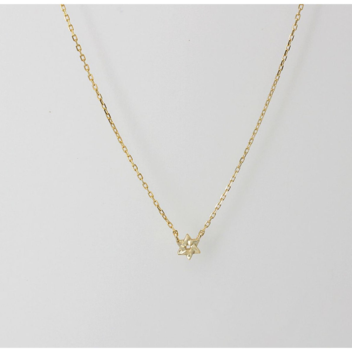 Teeny Tiny Star of David Pendant Necklace in Gold by Penny Levi