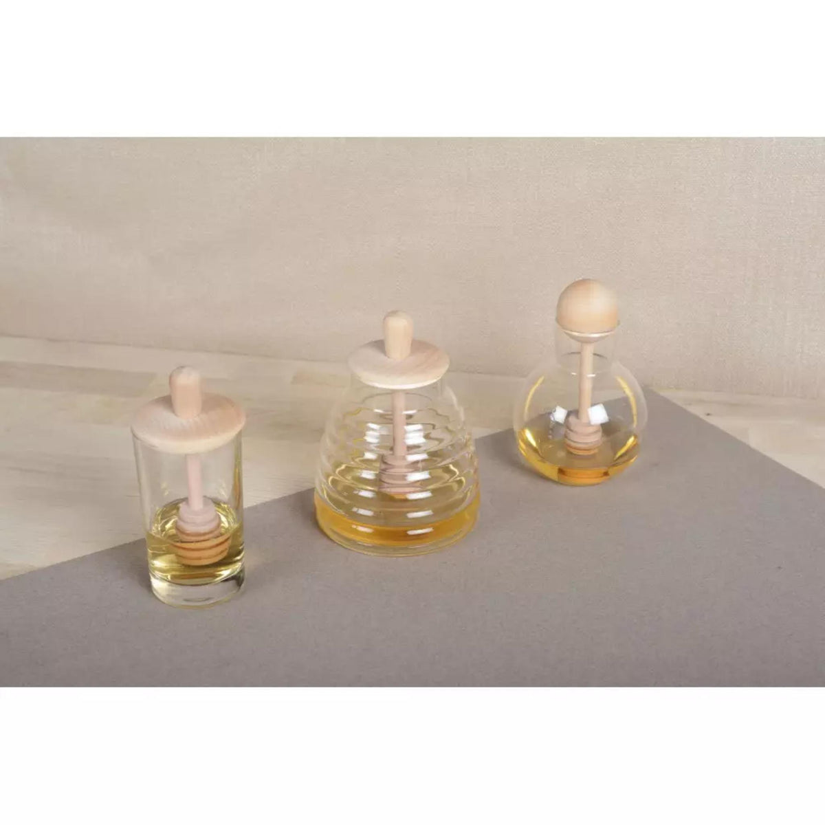 Round Honey Glass Pot with Wooden Ball Dipper by Aulicia